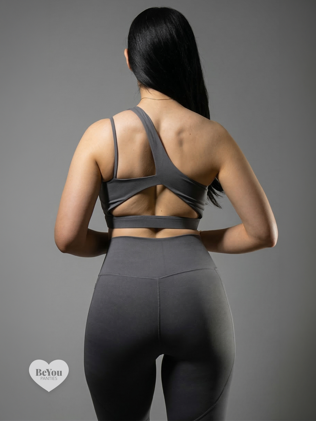 Set Deportivo "Ultra-Graphite" – Top Asimétrico de Doble Tirante y Leggings con Bolsillos